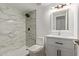 Modern bathroom with tiled shower, toilet, and vanity at 3350 W Las Palmaritas Dr, Phoenix, AZ 85051