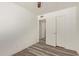 Bright bedroom featuring wood-look floors and an ensuite bathroom at 3350 W Las Palmaritas Dr, Phoenix, AZ 85051