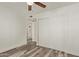 Bedroom featuring sliding closet doors, wood-look floors, and ensuite at 3350 W Las Palmaritas Dr, Phoenix, AZ 85051
