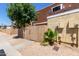 Home exterior featuring a wooden fence with a well-maintained stucco facade at 3350 W Las Palmaritas Dr, Phoenix, AZ 85051