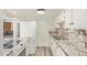A well-lit kitchen featuring modern appliances and luxurious marble countertops at 3350 W Las Palmaritas Dr, Phoenix, AZ 85051