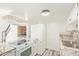 A well-lit kitchen featuring modern appliances and luxurious marble countertops at 3350 W Las Palmaritas Dr, Phoenix, AZ 85051