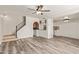 This living room has neutral paint, laminate flooring, and a staircase to the upper level at 3350 W Las Palmaritas Dr, Phoenix, AZ 85051