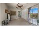 Comfortable bedroom with large window, ceiling fan, and decorative wall hangings at 36813 N 109Th Way, Scottsdale, AZ 85262