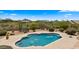 A gorgeous backyard pool area with desert landscape, mountain views, and mature plantings offers ultimate relaxation at 36813 N 109Th Way, Scottsdale, AZ 85262