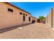 View of the side of the home with gravel landscape at 4041 N Silver Ridge Cir, Mesa, AZ 85207
