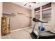 Exercise room with shelves, natural light, a treadmill, and an exercise ball at 4041 N Silver Ridge Cir, Mesa, AZ 85207