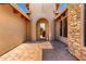 Inviting courtyard leading to the front door, featuring pavers and attractive architectural details at 4041 N Silver Ridge Cir, Mesa, AZ 85207