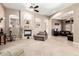 Spacious living room with a fireplace, open layout, and comfortable seating, perfect for entertaining at 4041 N Silver Ridge Cir, Mesa, AZ 85207