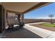 Expansive back patio with outdoor seating, a putting green, and a basketball court at 4108 N 304Th Ln, Buckeye, AZ 85396