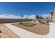 Private backyard featuring a putting green, basketball hoop, and outdoor seating area at 4108 N 304Th Ln, Buckeye, AZ 85396