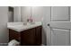 Bathroom featuring a clean single sink vanity, a framed mirror, and a neutral color scheme at 4108 N 304Th Ln, Buckeye, AZ 85396