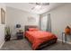 Bedroom with a bed, ceiling fan, and natural light streaming through the window at 4108 N 304Th Ln, Buckeye, AZ 85396
