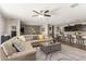 Spacious living room with an open floor plan and modern decor that flows into the dining area at 4108 N 304Th Ln, Buckeye, AZ 85396