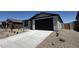 A charming home featuring low maintenance landscaping, a two car garage, and neutral tones at 4328 E Brook Lynn Pl, San Tan Valley, AZ 85143