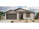 Charming single-story home featuring desert landscaping, a two-car garage and a neutral color palette at 4328 E Brook Lynn Pl, San Tan Valley, AZ 85143