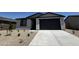 A charming home featuring low maintenance landscaping, a two car garage, and neutral tones at 4328 E Brook Lynn Pl, San Tan Valley, AZ 85143