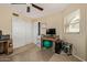 Bedroom featuring neutral carpet and walls, a ceiling fan, and white closet doors at 4514 E Verbena Dr, Phoenix, AZ 85044