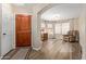 Welcoming foyer featuring hardwood floors and an open floor plan to a cozy sitting room at 4514 E Verbena Dr, Phoenix, AZ 85044