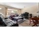 Inviting living room with a plush sofa and a view of the sparkling swimming pool at 4514 E Verbena Dr, Phoenix, AZ 85044