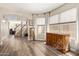 Bright open-concept living area features wood floors, stairs and large windows with coverings at 4514 E Verbena Dr, Phoenix, AZ 85044