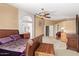 Spacious bedroom with vaulted ceilings, ensuite bathroom, and decorative ceiling fan at 4514 E Verbena Dr, Phoenix, AZ 85044