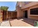 Private backyard patio with brick pavers, wood fence, and low-maintenance landscaping, ideal for outdoor living at 4901 E Kelton Ln # 1251, Scottsdale, AZ 85254