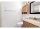 Bright bathroom features a wooden vanity with granite countertop and cabinet at 4901 E Kelton Ln # 1251, Scottsdale, AZ 85254