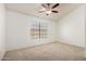Cozy bedroom features neutral carpet, vaulted ceiling, and a window at 4901 E Kelton Ln # 1251, Scottsdale, AZ 85254