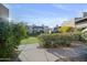 A beautiful landscaped lawn in front of multiple condo units at 5998 N 78Th St # 116, Scottsdale, AZ 85250