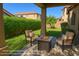 Inviting back patio with comfortable seating and a cozy fire pit, perfect for outdoor relaxation and entertaining at 7261 E Norland St, Mesa, AZ 85207