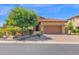 Exterior elevation of a home with a well-kept yard and desert landscaping at 7261 E Norland St, Mesa, AZ 85207