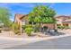 Charming single-story home features a red tile roof, desert landscaping, and a two-car garage at 7261 E Norland St, Mesa, AZ 85207