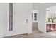 Bright foyer showcasing tile flooring, an exterior window, and a view into the bedroom and bathroom at 7261 E Norland St, Mesa, AZ 85207