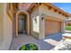 Inviting home entrance with a brick-paved walkway and charming arched doorway at 7261 E Norland St, Mesa, AZ 85207