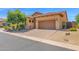 Home with brick driveway leading to a two-car garage, complemented by a red tile roof at 7261 E Norland St, Mesa, AZ 85207