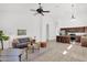 Bright and open living area featuring a view of the kitchen, tile flooring and neutral decor at 7261 E Norland St, Mesa, AZ 85207