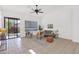 Spacious living area with tile floors, neutral decor, lots of windows, and a sliding door to the backyard at 7261 E Norland St, Mesa, AZ 85207