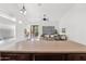 Open living area with neutral decor, tile flooring, natural light, and sliding door access to the backyard at 7261 E Norland St, Mesa, AZ 85207