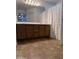 Bathroom featuring a double vanity with wood cabinets, a large mirror, and tile flooring at 7321 S 48Th Dr, Laveen, AZ 85339