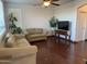 Comfortable living room with hardwood floors, neutral walls, and plenty of natural light at 7321 S 48Th Dr, Laveen, AZ 85339