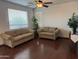 Comfortable living room with hardwood floors, neutral walls, and plenty of natural light at 7321 S 48Th Dr, Laveen, AZ 85339
