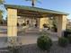 Community picnic pavilion with multiple tables, mature landscaping and lush green plants at 7321 S 48Th Dr, Laveen, AZ 85339