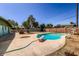 Large backyard with a sparkling pool, outdoor area, and ample space for entertaining at 736 E Loyola Dr, Tempe, AZ 85282