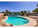 Inviting backyard showcasing a refreshing pool and concrete patio, perfect for relaxation at 736 E Loyola Dr, Tempe, AZ 85282