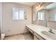 Bathroom featuring a large vanity, mirror and window with natural light at 736 E Loyola Dr, Tempe, AZ 85282