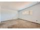 Neutral bedroom featuring plush carpet, a window with blinds, and ample natural light at 736 E Loyola Dr, Tempe, AZ 85282