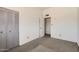 Bedroom featuring double closet, open door to small ensuite and light colored walls at 736 E Loyola Dr, Tempe, AZ 85282