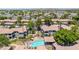 Aerial view of the community featuring lush landscaping, a pool, and well-maintained buildings at 7401 W Arrowhead Club Dr # 2067, Glendale, AZ 85308