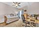 Comfortable bedroom with ample natural light, desk, and dedicated workspace at 7401 W Arrowhead Club Dr # 2067, Glendale, AZ 85308